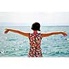 Young pretty woman enjoying the sun and the sea