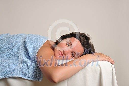 back massage at the spa and wellness center with beautiful brinette woman back massage at the spa and wellness center with beautiful brinette woman