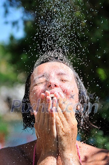 young pretty woman relaxing under shower young pretty woman relaxing under shower