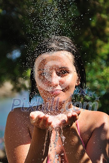 young pretty woman relaxing under shower young pretty woman relaxing under shower