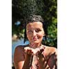 young pretty woman relaxing under shower
