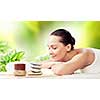 Image of young woman relaxing in spa salon