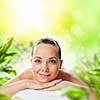 Image of young woman relaxing in spa salon