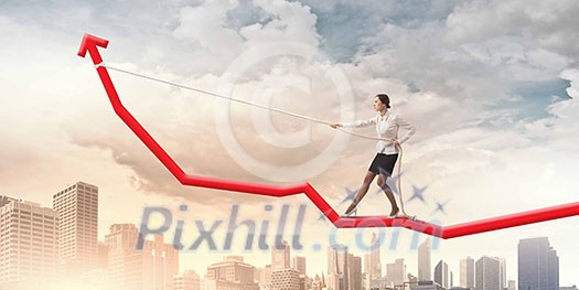 Image of businesswoman standing on graph. Income and profit Image of businesswoman standing on graph. Income and profit