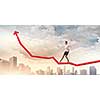Image of businesswoman standing on graph. Income and profit
