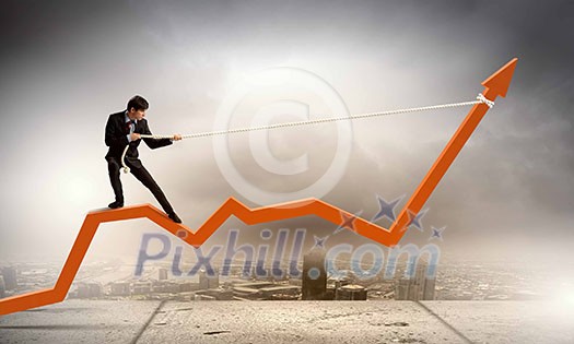Image of businessman standing on graph and pulling it upwards Image of businessman standing on graph and pulling it upwards