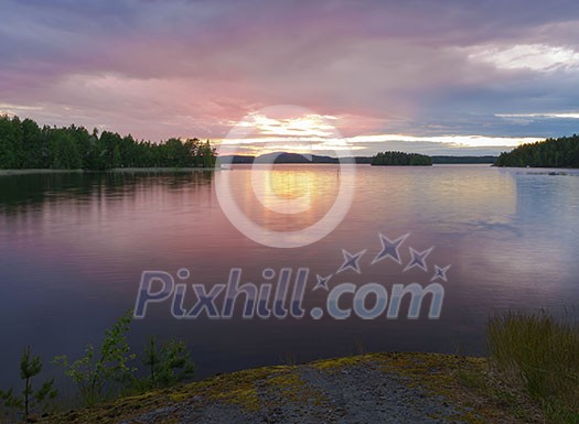 Calm lake scenery in summernight after sunset Calm lake scenery in summernight after sunset