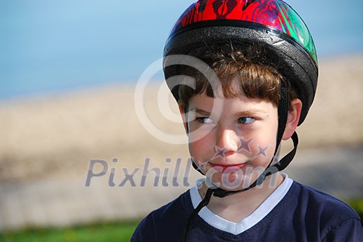 Portrait of a young boy in a bicycle helmet Portrait of a young boy in a bicycle helmet