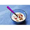 Breakfast cereal in a bowl with a spoon
