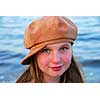 Portrait of a cute girl in suede hat