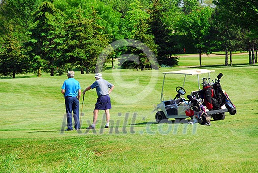 Two senior men on golf course Two senior men on golf course