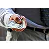 Hand of a businessman offering money