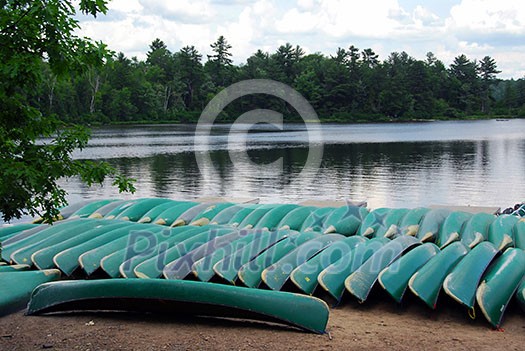 Canoes on lake shore in northern Ontario Canoes on lake shore in northern Ontario