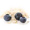 Blueberries and oats macro on white background