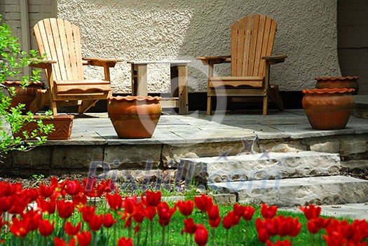 House patio with wooden chairs House patio with wooden chairs