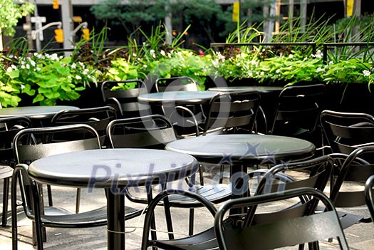Restaurant outdoor patio with black patio firniture Restaurant outdoor patio with black patio firniture