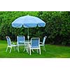 Patio furniture on green lawn
