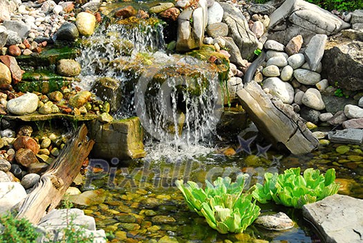 Natural stone pond as landscaping design element Natural stone pond as landscaping design element