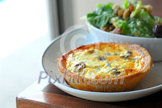 Quiche and caesar salad Quiche and caesar salad