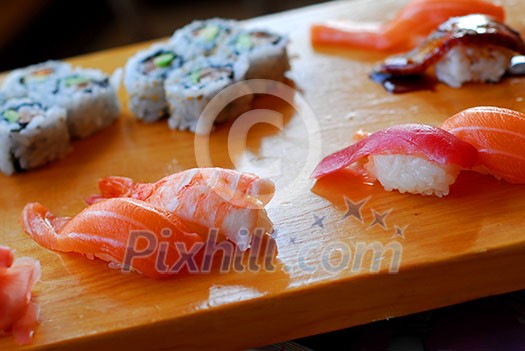 Sushi served on a wooden board Sushi served on a wooden board