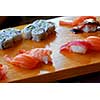 Sushi served on a wooden board
