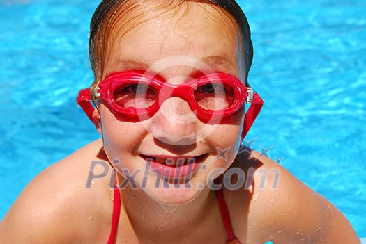 Portrait of a smiling girl in red goggles Portrait of a smiling girl in red goggles