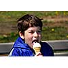 Little boy licking ice cream