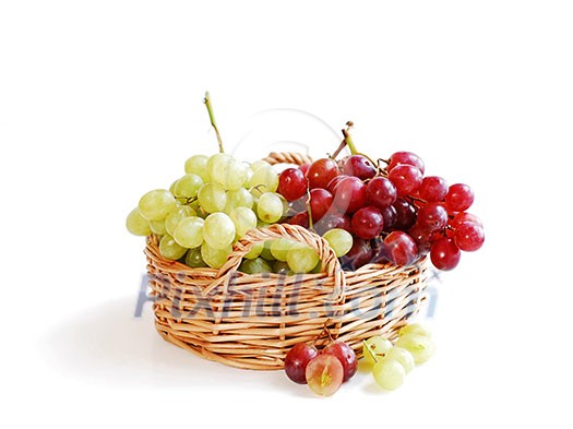 Grapes in a basket isolated on white background Grapes in a basket isolated on white background