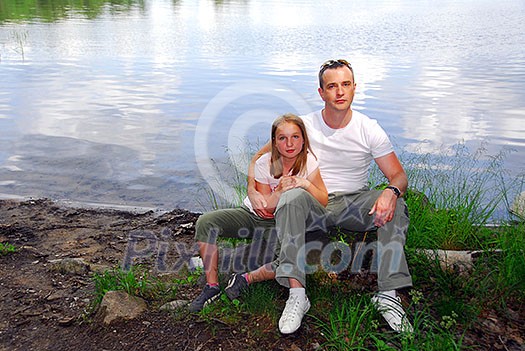 Portrait of father and daughter on the lake shore Portrait of father and daughter on the lake shore