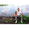 Portrait of father and daughter on the lake shore