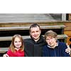 Daughter, father and grandmother on the deck stairs