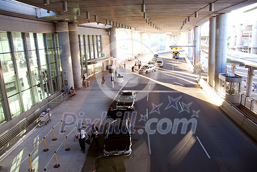 Travelers getting taxis at airport Travelers getting taxis at airport