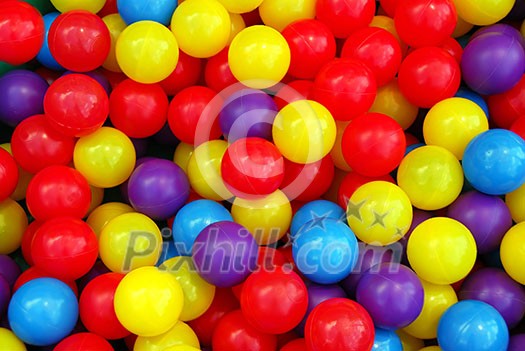 Background of colorful plastic balls at indoor playground Background of colorful plastic balls at indoor playground