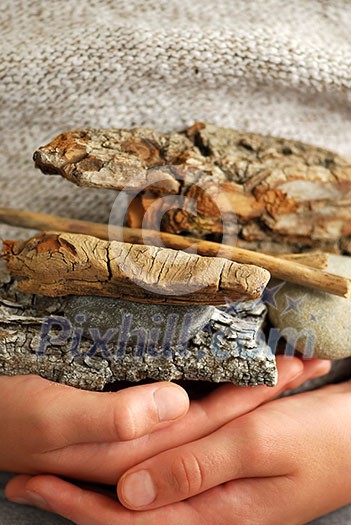 Child hands holding beach treasures collected on sea shore Child hands holding beach treasures collected on sea shore