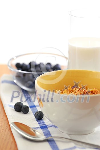 Healthy breaksfast of cereal, milk and blueberries Healthy breaksfast of cereal, milk and blueberries