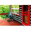 Deck of a log cottage in pine forest