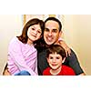 Portrait of a father with two children