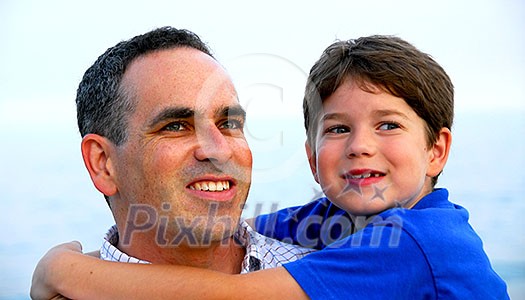 Portrait of a father holding his son Portrait of a father holding his son