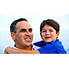 Portrait of a father holding his son