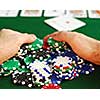 Poker player raking a big pile of chips