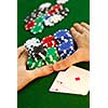 Poker player going 'all in' pushing his chips forward