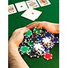 Poker player raking a big pile of chips
