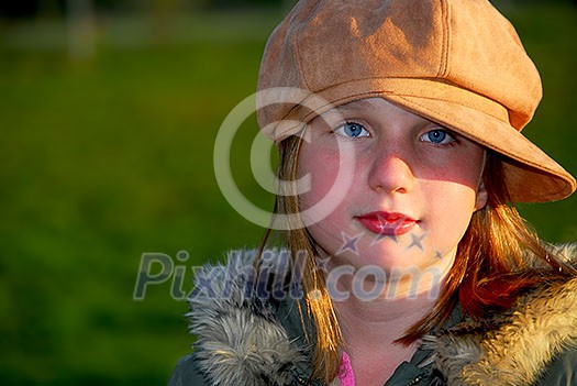 Portrait of a young girl wearing suede hat on green background Portrait of a young girl wearing suede hat on green background