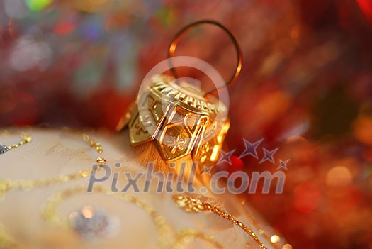 Closeup of golden christmas tree ornament glass ball Closeup of golden christmas tree ornament glass ball