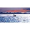 Man on jet ski at sunset