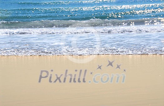 Ocean shore with sandy beach and advancing wave Ocean shore with sandy beach and advancing wave