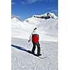 Girl snowboarding on the backdrop of scenic view in Canadian Rocky mountains ski resort