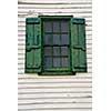 Window with shutters on old mill building