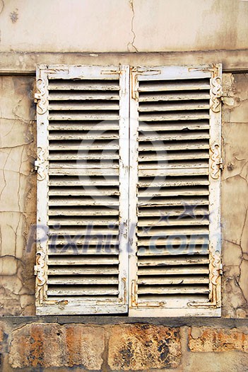 Old window with shatters in Paris France Old window with shatters in Paris France