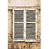 Old window with shatters in Paris France